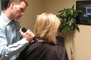 Brent uses the pro-adjuster on a patient